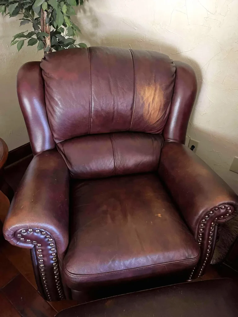 Faded leather armchair with worn color - leather furniture repair