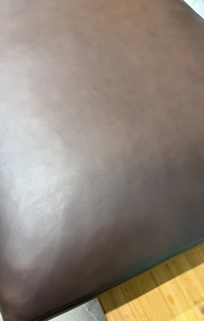 Leather sofa after repair with restored surface in Charlotte NC